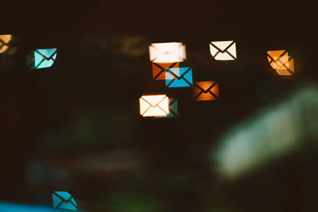 bright email icons on a dark background